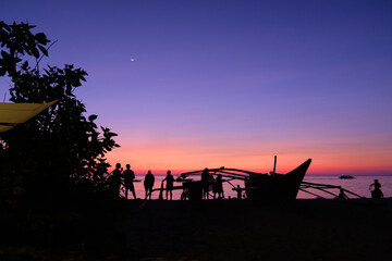 Boracay, Philippines - Jan 27, 2020: Sunset on Boracay island. Sailing and other traditional boats...