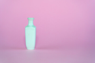 White vase on a dew background.