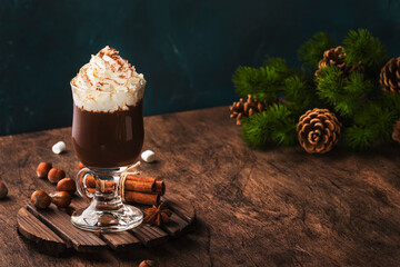 Liquid dark chocolate with whipped cream and cocoa powder. Winter and autumn time drink dessert....