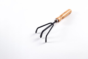 Small gardening fork isolated on white backgroun