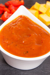 Pumpkin ketchup with ingredients for preparing sauce