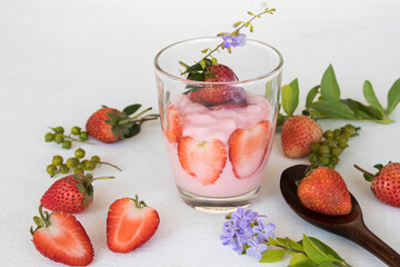 healthy foods yogurt from fruits strawberry for diet weight with purple flower decoration flat lay style on background white 