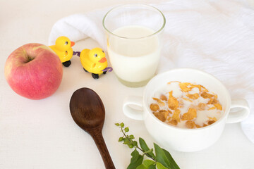 mix corn flakes, milk healthy foods for children eats and healthy drinks fresh milks in breakfast decoration flat lay style on background wooden white