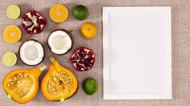 Frame for text appear next to sliced fresh ripe fruits. Stop motion 