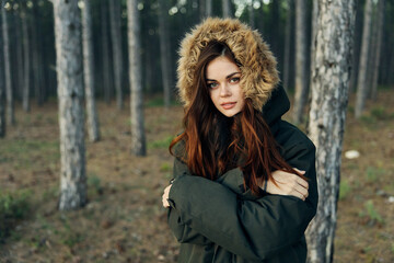 Pretty woman jacket with hood coolness forest nature holiday