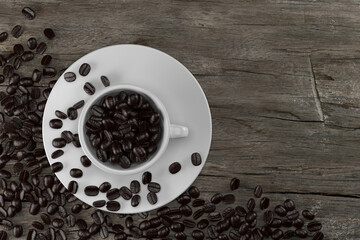 Cup and coffee beans on wooden, 3D rendering.