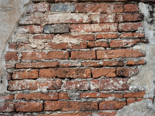 Old brick walls overlap the sides with cement