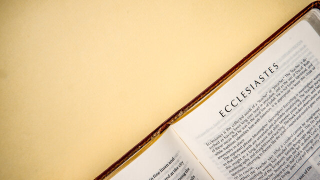 Open pages of the bible background (book of Ecclesiastes)