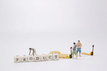 a mini worker with wood letters making product analysis text
