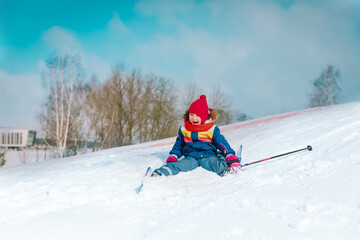 Fototapeta na wymiar happy little girl ski in winter nature