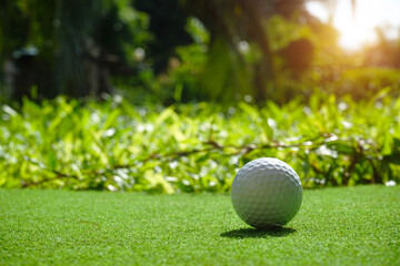 Golf balls on the golf course with golf clubs ready for golf in the first short. In the morning, with the beautiful sunlight.Sports that people around the world play in the holidays