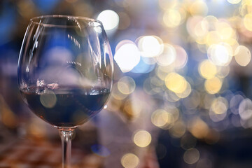 evening in a restaurant, blurred abstract background, bokeh, alcohol concept, wine glasses in a bar