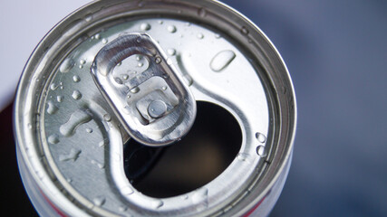 Opened metal aluminum can for soda, beer, energy drinks and mineral water. Water drops on an aluminum can. Refreshing drink. A drink with gases.