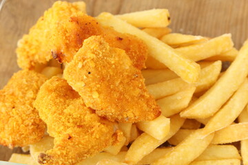 lots of fresh crispy chicken nuggets with french fries