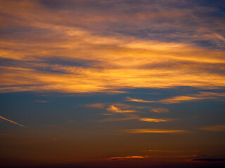 Orange clouds and blue sky at sunset