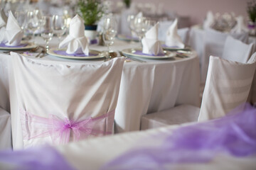 Fototapeta na wymiar Lovely wedding venue - Wedding reception room, tables set and ready