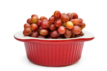 Ceramic pot with fresh grapes on white.