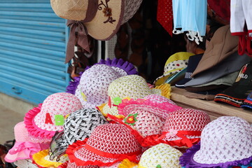 Attractive caps of beautiful workmanship decorated at the retail shop for the upcoming festivities