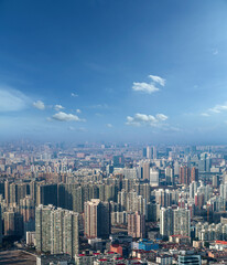 aerial view of Shanghai cityscape and modern skyscraper city in misty sky background behind pollution haze, in Shanghai, China.