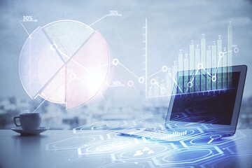 Stock market graph and table with computer background. Double exposure. Concept of financial...