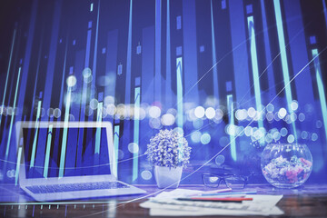 Financial chart drawing and table with computer on background. Multi exposure. Concept of...