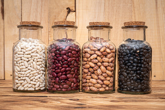Four Jars of dried beans, White, Borlotti, Black and Kidney Beans. Dried for storage and preservation, long shelf life nutritional food.