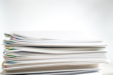 A pile of documents with copy space on white background.