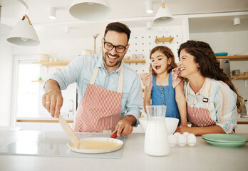 family child kitchen food daughter mother father cooking preparing pancake breakfast  happy together