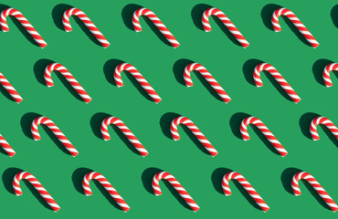 candy lollipops on a green background. graphic pattern. happy new year and christmas