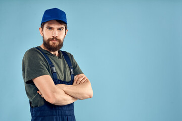 man in work uniform uniform professional work lifestyle delivery service blue background
