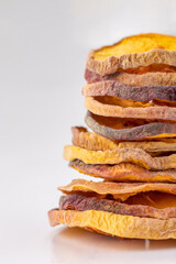slices of dried peach on a white background. dried fruits. eco. macro.