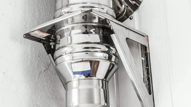 Part of the house ventilation system of stainless steel pipes.