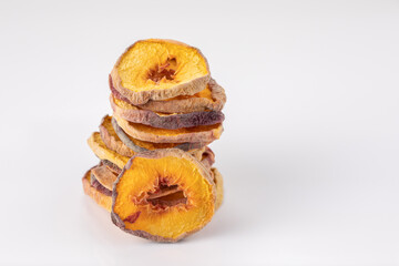 slices of dried peach on a white background. dried fruits. eco. macro.