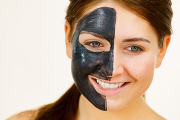 Woman with charcoal facial mask