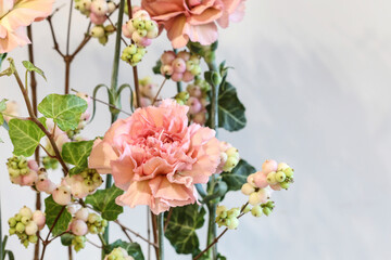 Modern floral arrangement with pink carnations.