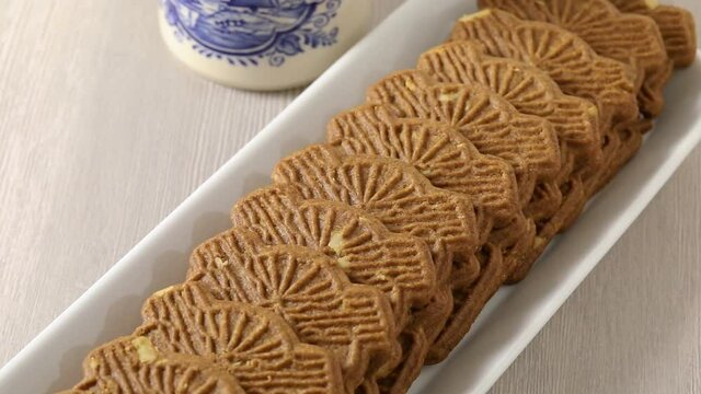 Traditional fresh baked Dutch cookies called speculaas in t he shape of a windmill close up