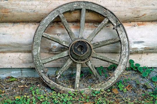 A wheel made of wood from a cart. Retro.	
