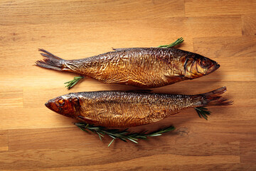 Smocked herring on a wooden table.