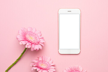 Mobile phone and pink flower on a pastel background