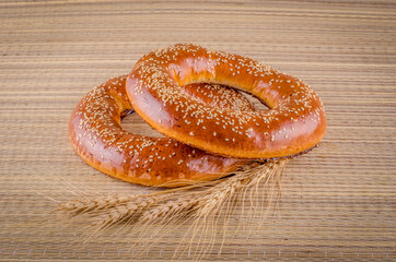 Bagel with wheat spike - bakery food photo