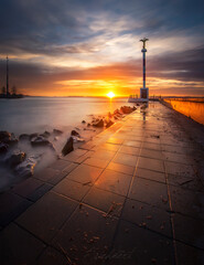 Beautiful sunset at Lake Balaton in Hungary. Photographed beautiful sky with reflection in the lake on the coast.

