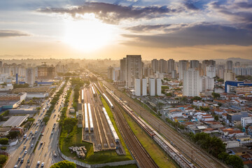 train wagons next to Avenida Radial Leste at sunset, Tatuape neighborhood, Sao Paulo, Brazil