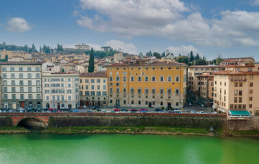 Fototapeta premium Buildings bordering the arno in Florence in Tuscany, Italy