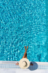 woman in luxury spa resort near the swimming pool. - 387548279