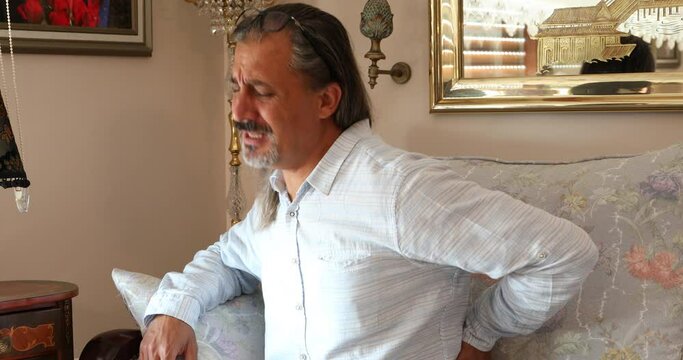 Middle aged woman suffering from waist pain during boat travelling