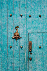 Blue wooden door in La Candelaria. Bogota, Colombia