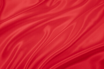 Beautiful elegant wavy hot red satin silk luxury cloth fabric texture, abstract background design. Wallpaper, banner or card