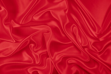 Beautiful elegant wavy hot red satin silk luxury cloth fabric texture, abstract background design. Wallpaper, banner or card