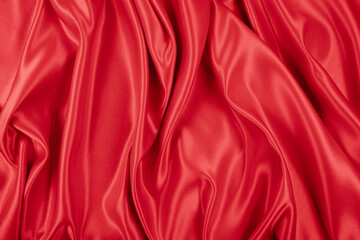 Obraz premium Beautiful elegant wavy hot red satin silk luxury cloth fabric texture, abstract background design. Wallpaper, banner or card