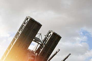 A closeup of a Russian anti-aircraft missile launcher pointing upwards - obrazy, fototapety, plakaty